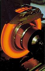 [glowing brake disk in testing assembly]